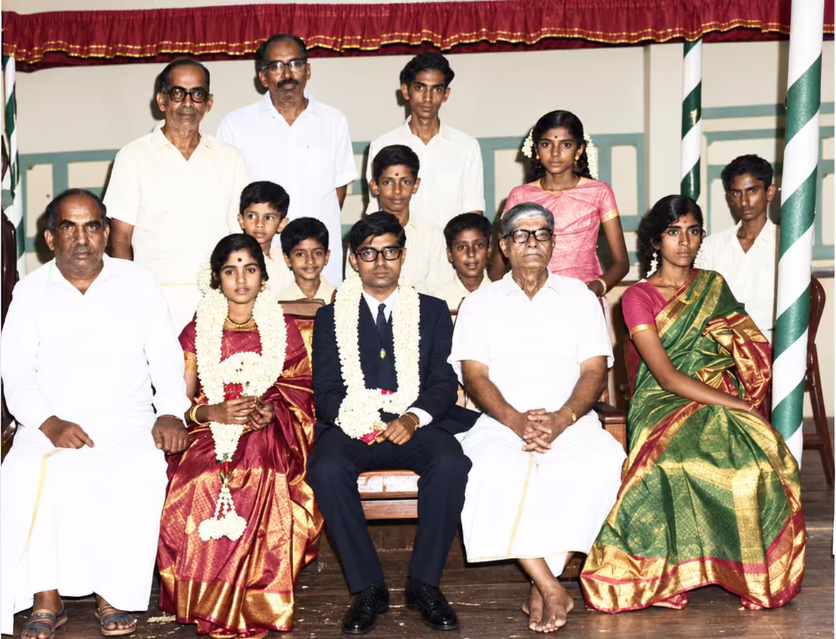 A further-edited version of the wedding photo, sharpened as if shot on a modern digital camera, with the same subtle drift toward smiling faces even more pronounced.